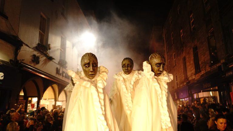 Macnas performers in costume at a Halloween parade